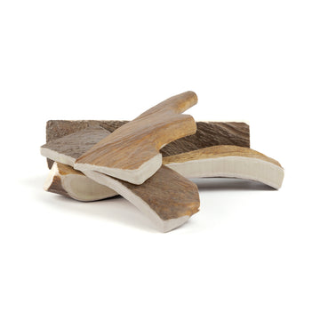 four extra large moose paddles in a pile on a white background